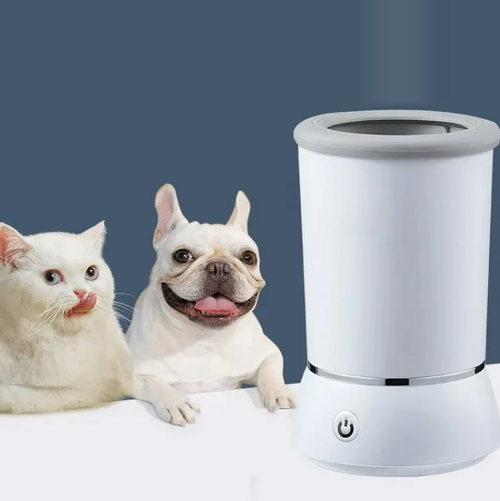 White SoftStep automatic paw cleaner cup next to a dog and a cat