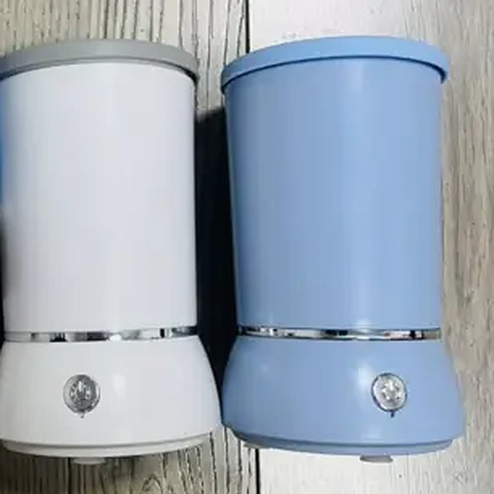 White and blue SoftStep paw cleaners side by side, each with a power button on the base
